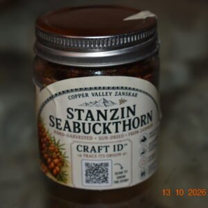 Whole dried seabuckthorn berries in a Copper Valley jar, front view
