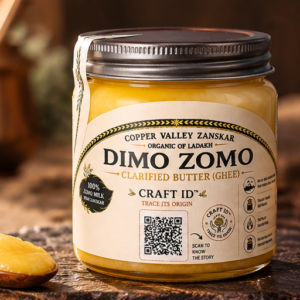 Dimo Zomo clarified butter jar with a spoon of ghee
